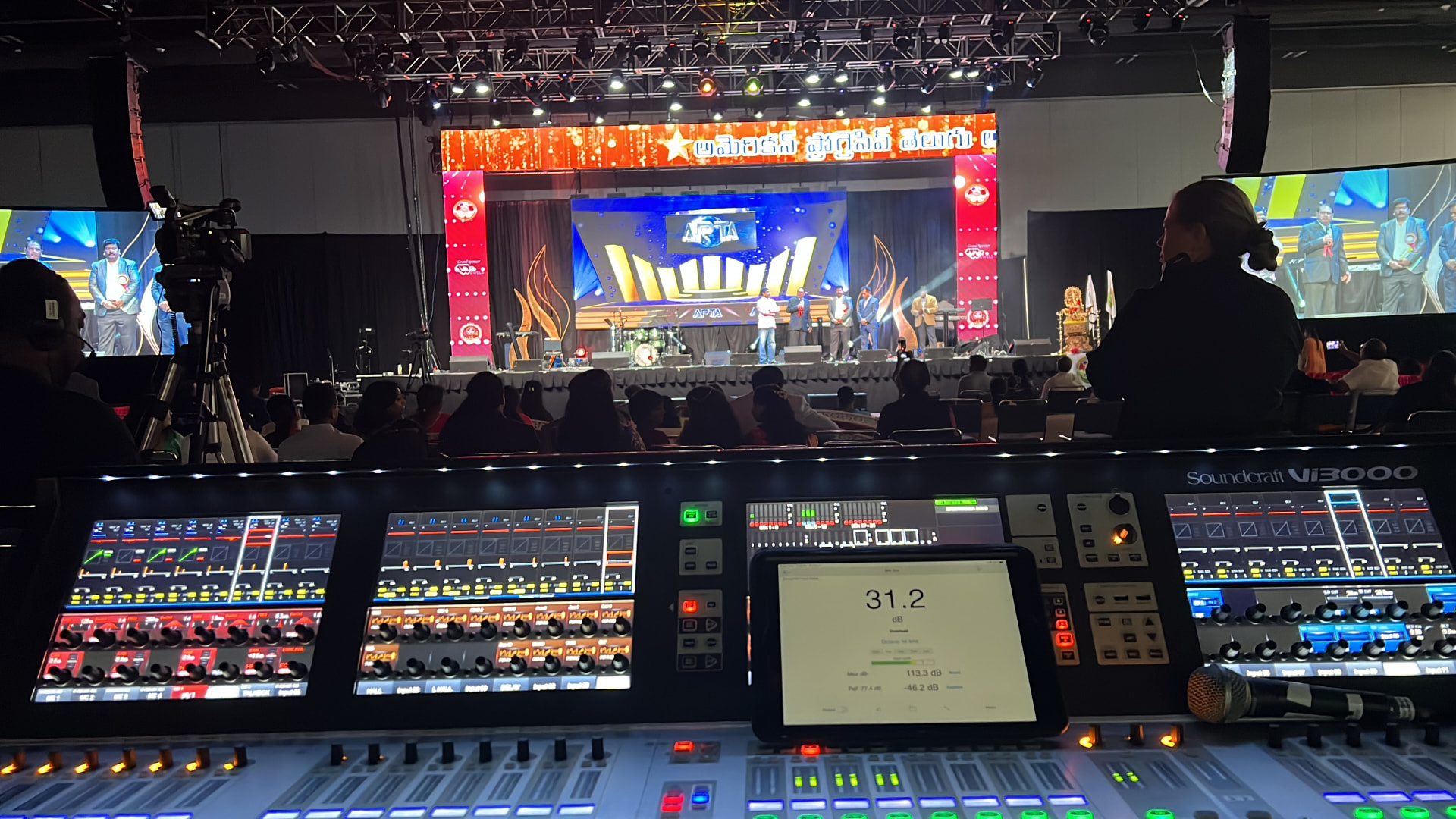 Awards show stage with LED scenic wall and side screens seen from the Soundcraft Vi3000 mix position