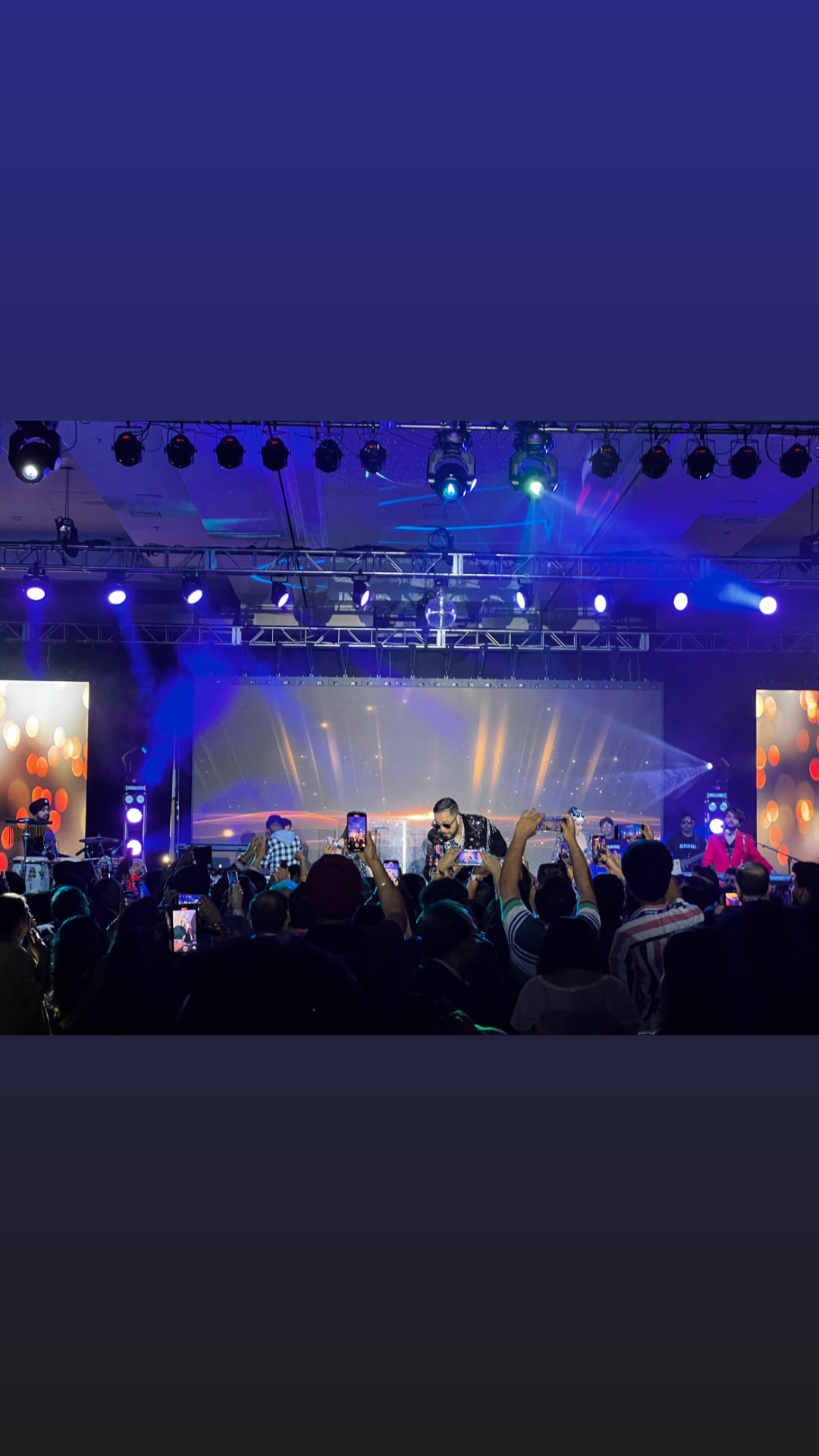Concert production — line-array PA, moving-head rig and stage build